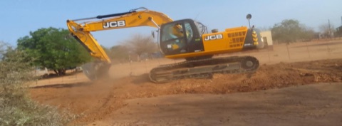 JCB excavator at work on a Mocheku Landscapers earthworks site