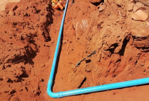 Water reticulation pipe elbow joint laid in trench